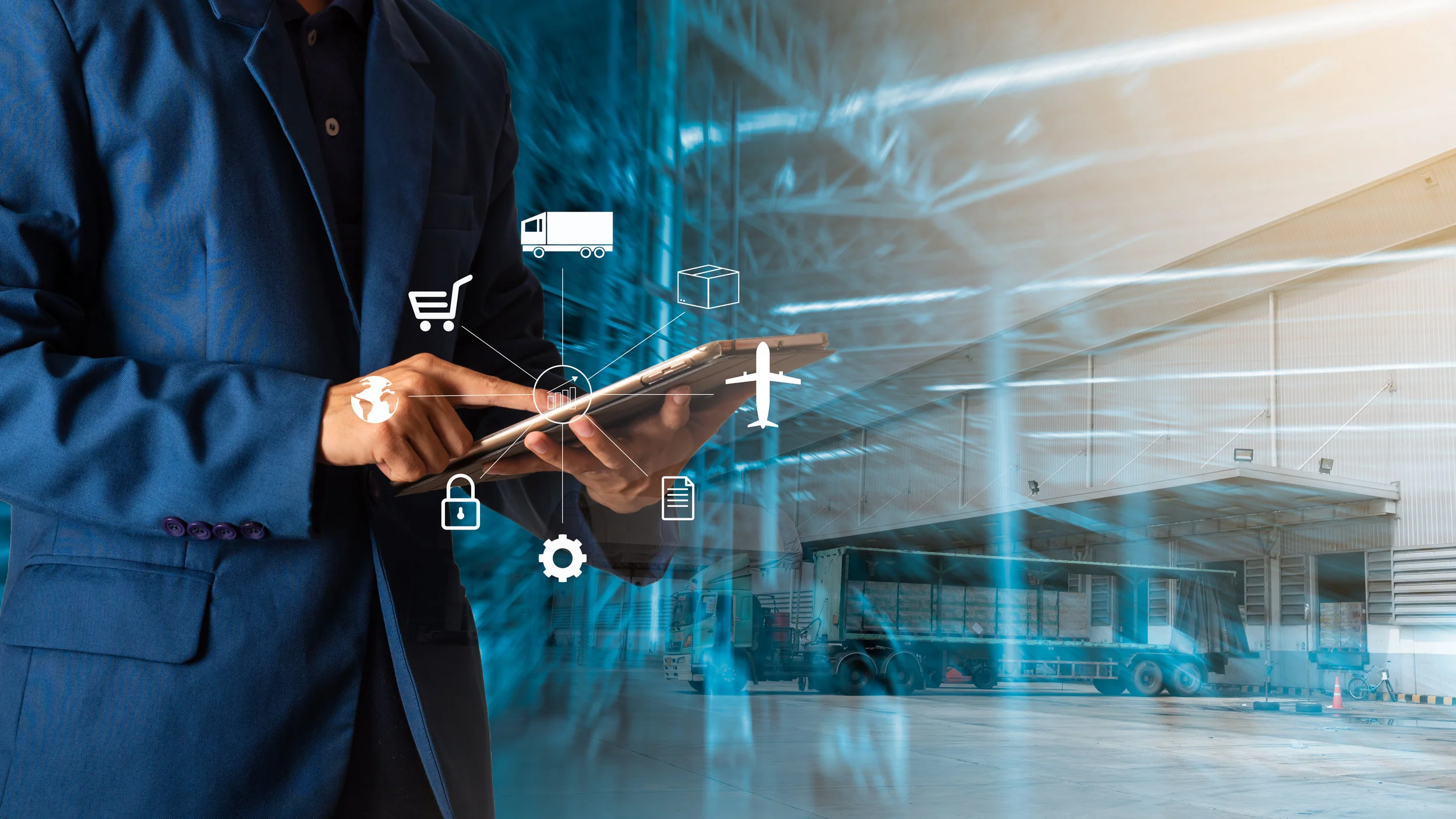 Canva - Businessman using tablet computer with Modern Trade warehouse logistics, uncle plans to invest in transport, from domestic to global.Industry 4.0 concept,planning of logistics..jpg