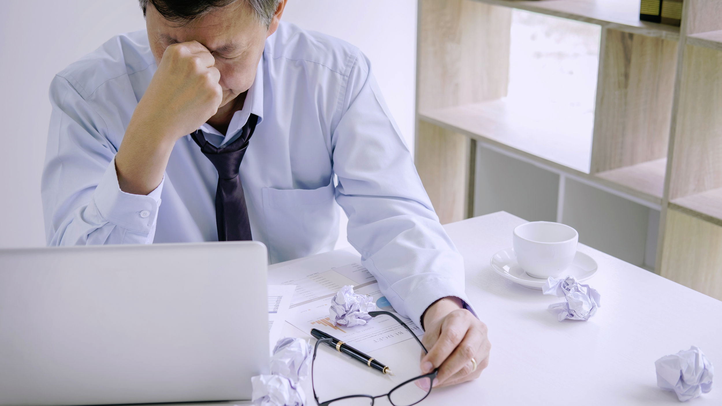 Canva+-+Feeling+sick+and+tired%2C+Senior+businessman+depressed+and+exhausted%2C+businessman+at+his+desk+frustrated+with+problems+and+keeping+eyes+closed+while+sitting+on+office.jpg