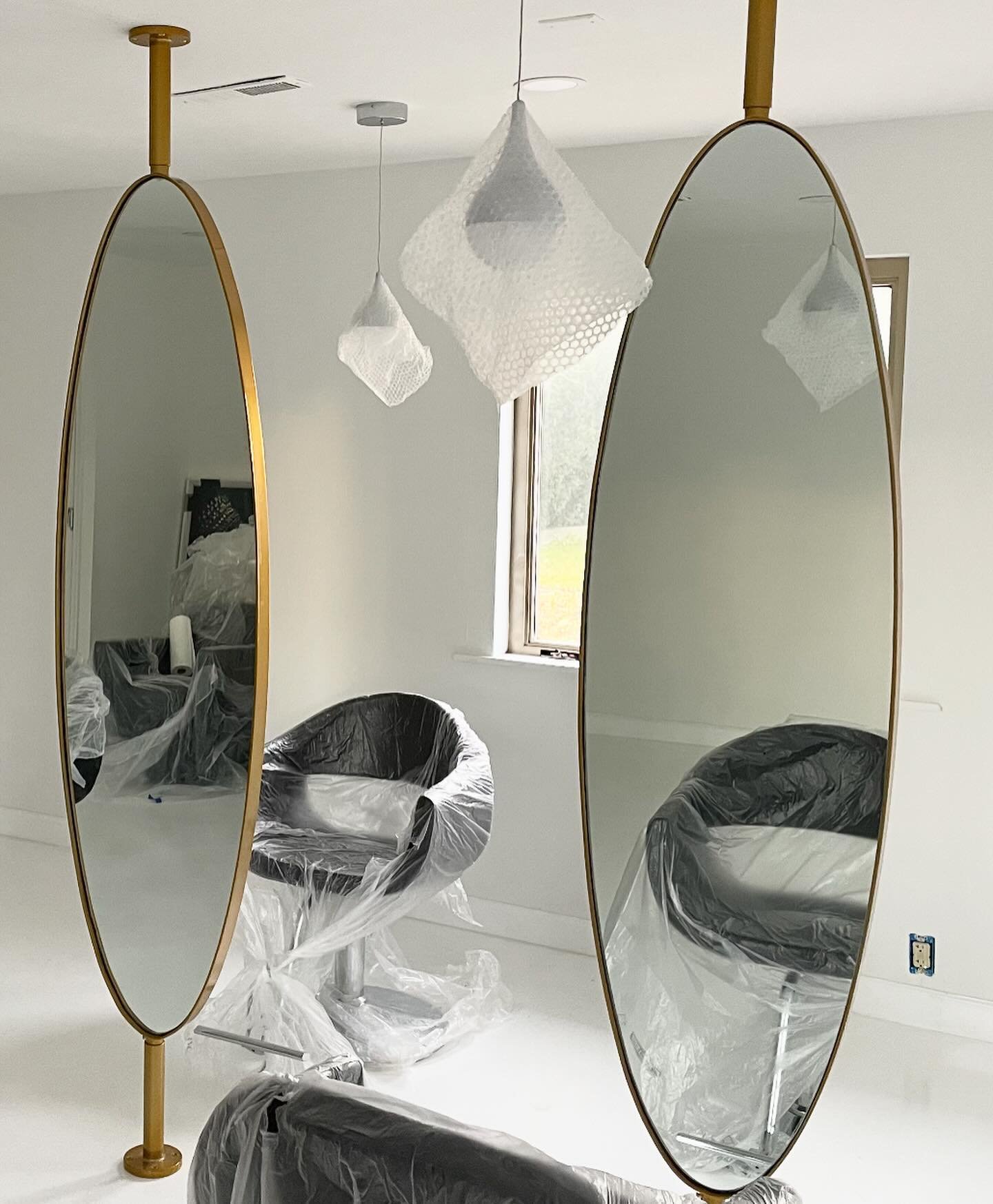 Many moons ago I made these oval salon mirrors. The design (not mine) was for brass, but not in the budget unfortunately so we went with powdercoated steel.  They pivot 360 degrees but I always question if those extra functions are ever actually used