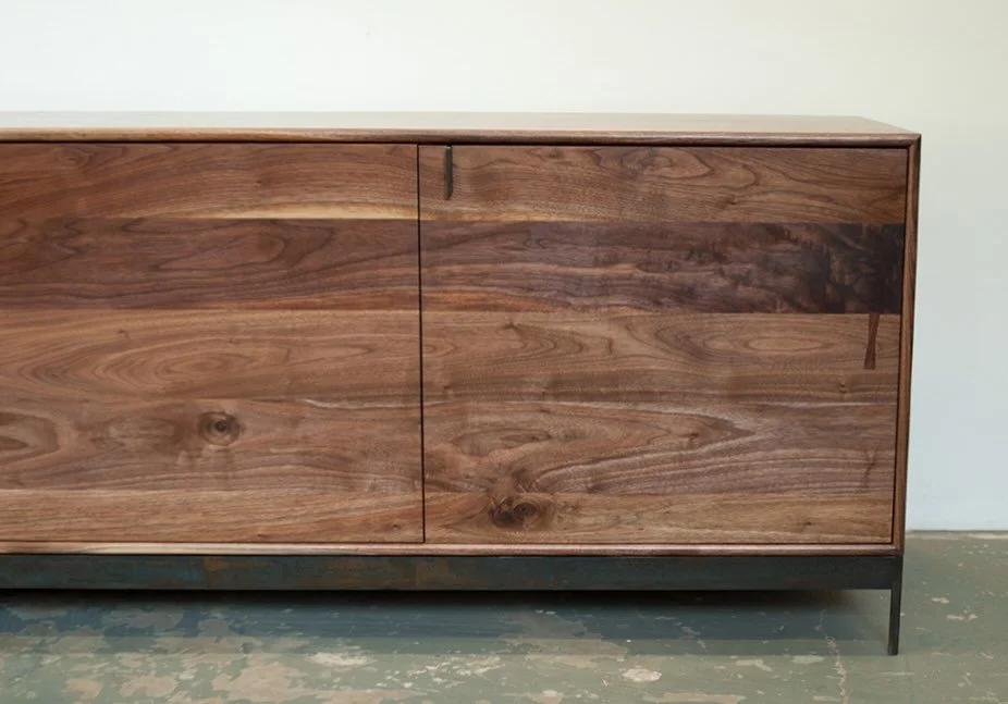 Our Lauren collection of case goods is shown here as a sideboard with a custom metal base, but we also make them as credenzas, dressers and nightstands. Shown here in oiled Walnut, available in white oak, ash and cherry, in a variety of finishes. 
Th