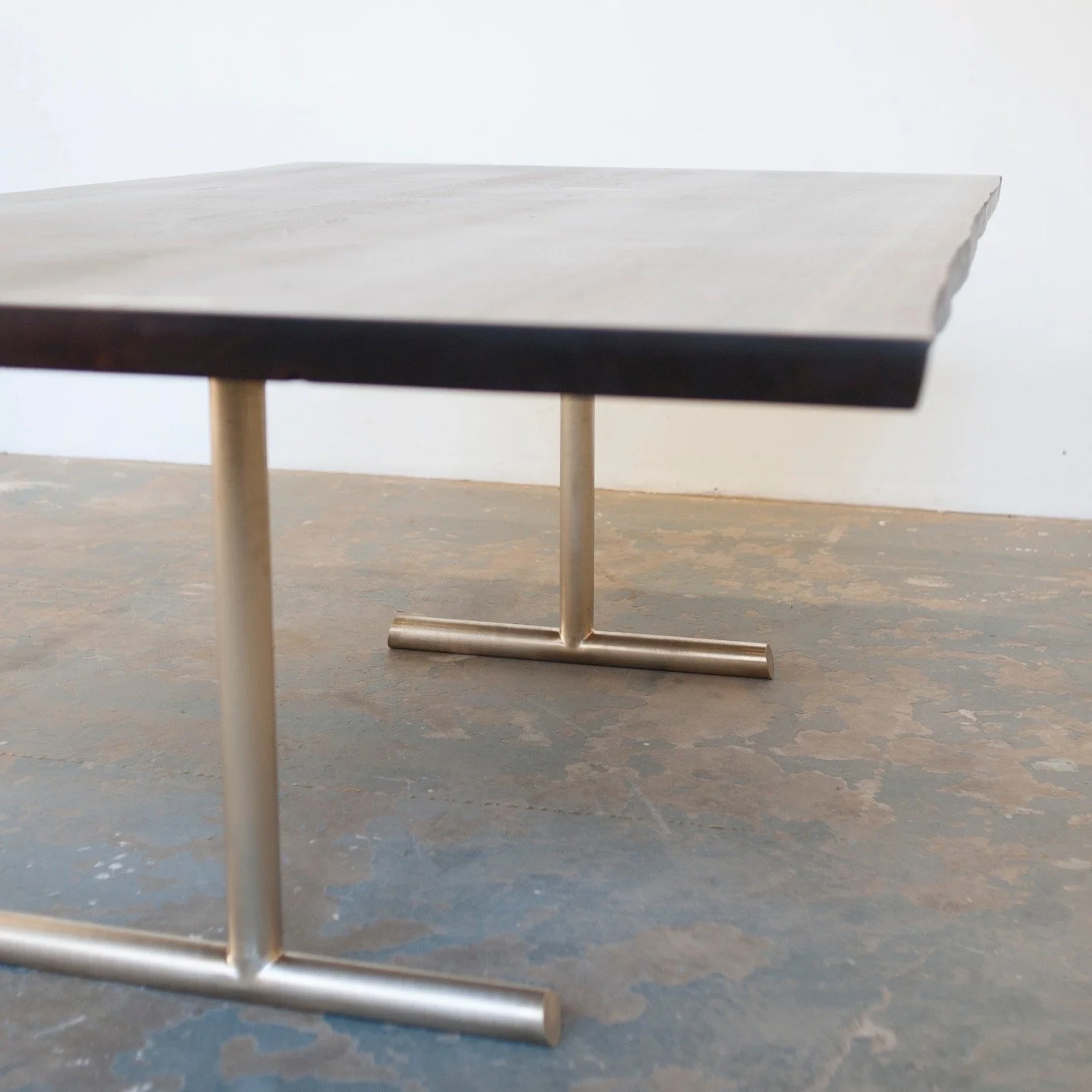 A table a day... Day 3. A live-edge walnut slab top with bronze base. Machined from tube stock and welded here in the studio. 😍