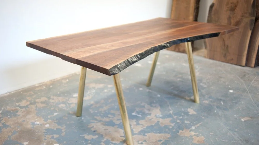 A table a day.... Day 6. Live edge walnut with brass base.