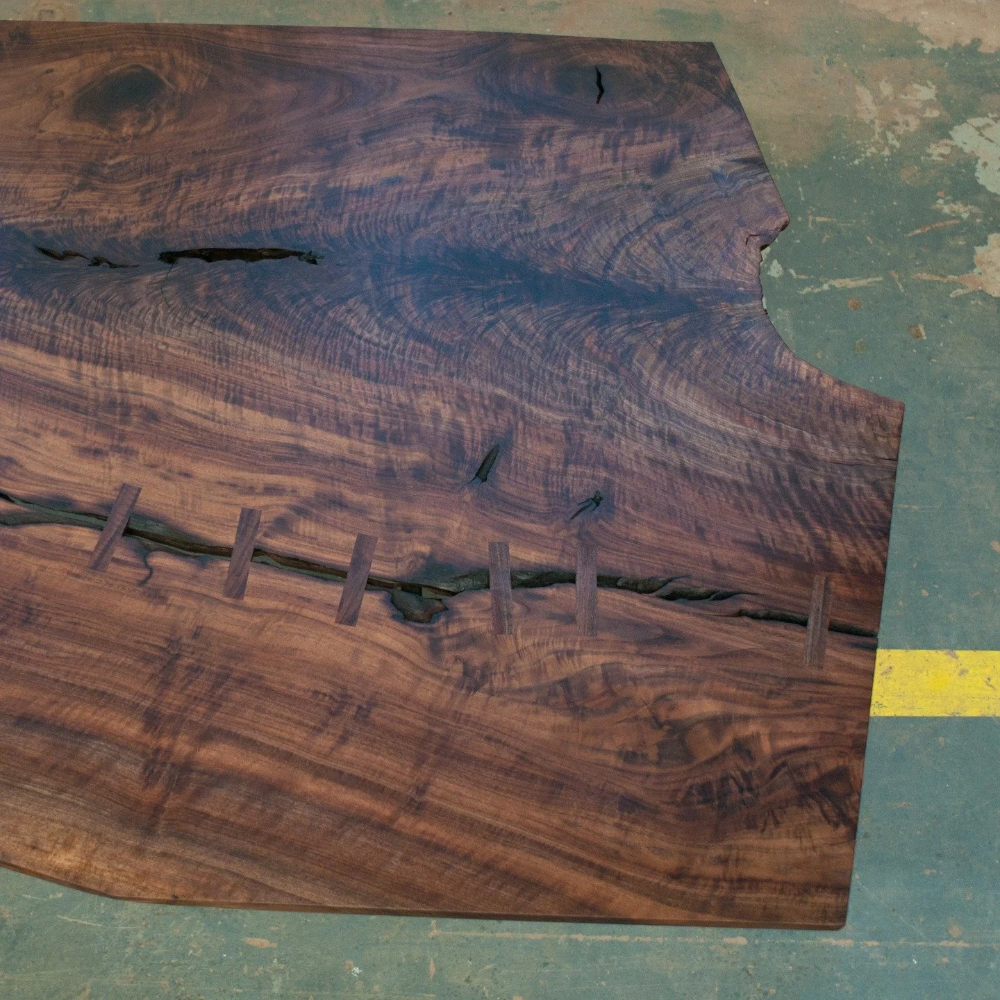 A table a Day... Day 7. Claro walnut slab dining table with some inlayed stitches. The grain on Claro walnut is absolutely insane. This was 9' long by 5' wide. #customfurniture #woodworking