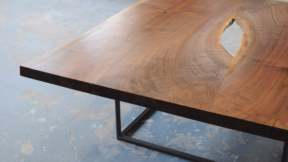 A table a day....Day 8. Continuing our run of sexy walnut slabs.....A 4'x4' coffee table with 2 matching slabs. These are end cuts and one slab is flipped to create this symmetrical void in the middle.