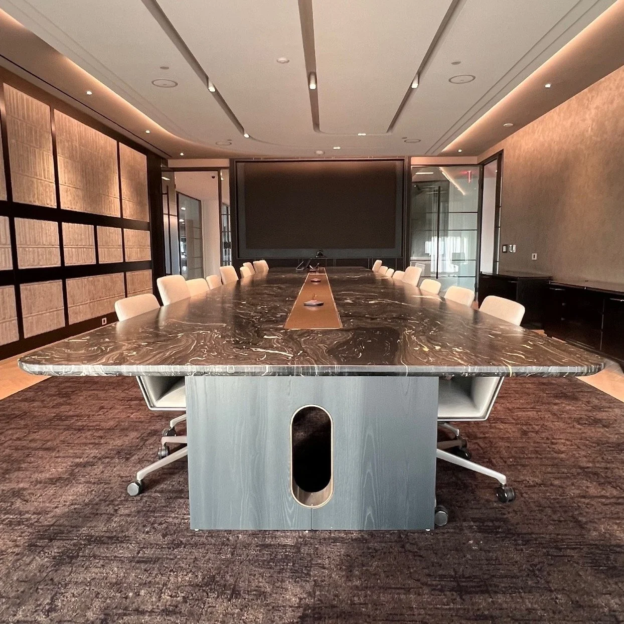 A table a day.... Day 9. A few months ago we were asked to fabricate this steel and ash base for a 24' x 5' marble conference table. We made the powder coated steel strip running the length of it and a nice steel cut out detail in the legs. For these
