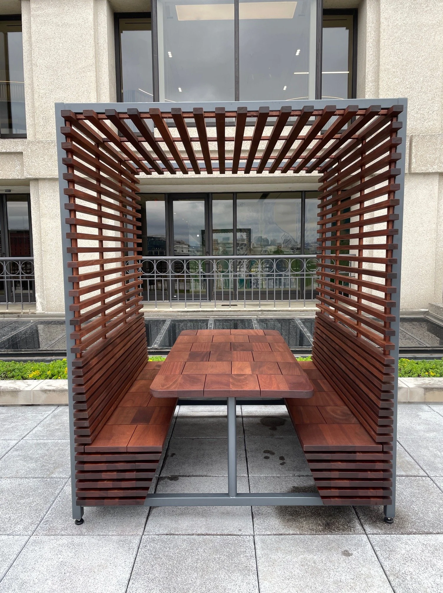 Definitely our coolest project in 2025.... We built 3 of these pergolas for a terrace overlooking (what used to be) the east wing of the White House. 
Made from stained sapele with powder coated steel frames. They had to be built so they could fit in