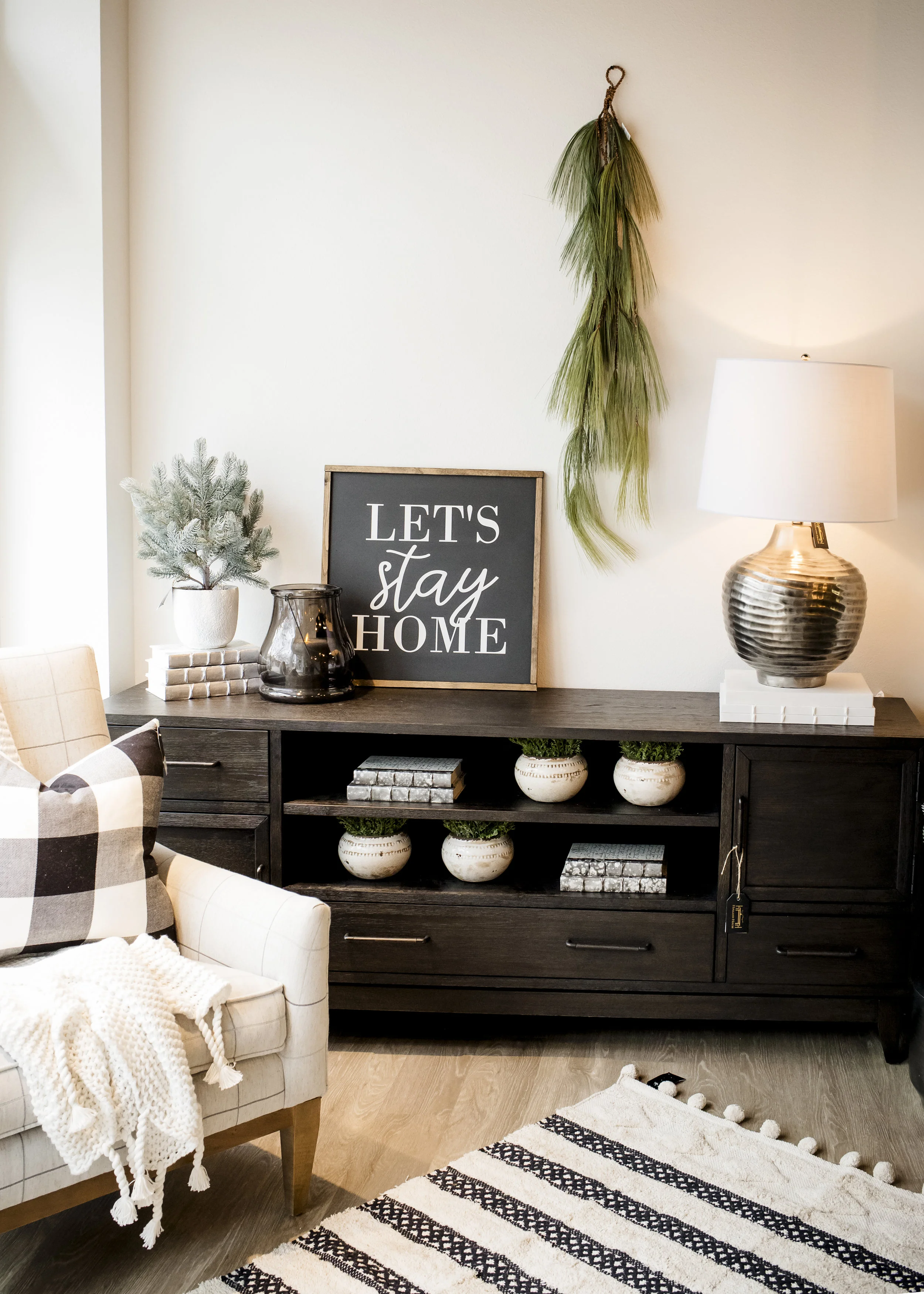 Silver Spine Books $42/ec, White Callie Vase $12.50/ec, Battery Powered & Timer option Platinum Candle $44, Blue Spruce $42, White Organic Cotton Throw $142, Cotton Woven Black/White 3x5 Rug $99, Buffalo Plaid Pillow $41.50, Let’s Stay Home Sign $71