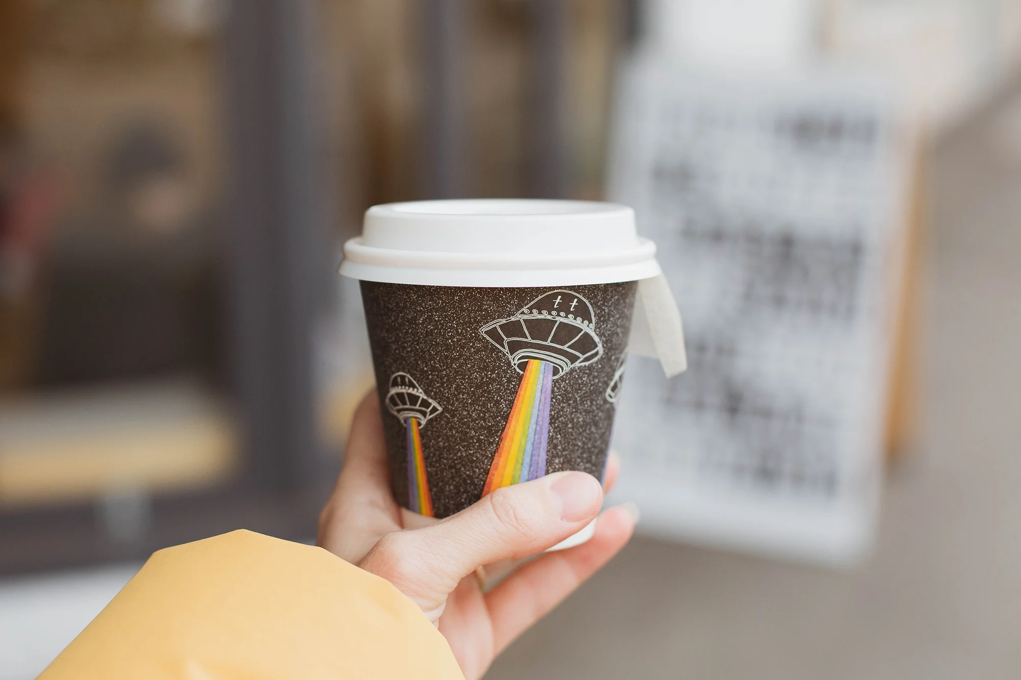 to go cup art designed by Robbins and illustrated by local artist Ella Duret