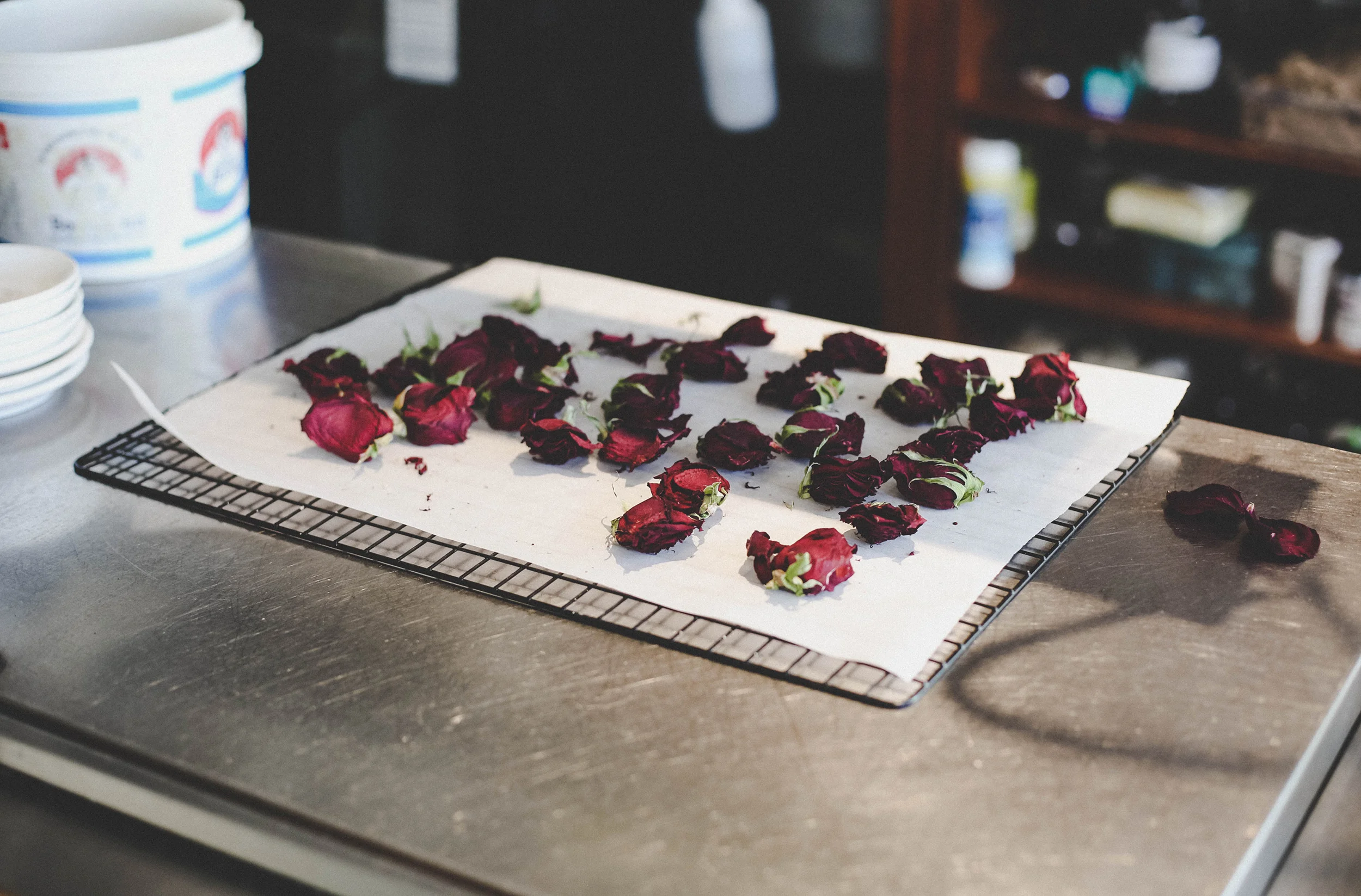 The process of drying roses. The petals are used in cocktails and desserts.