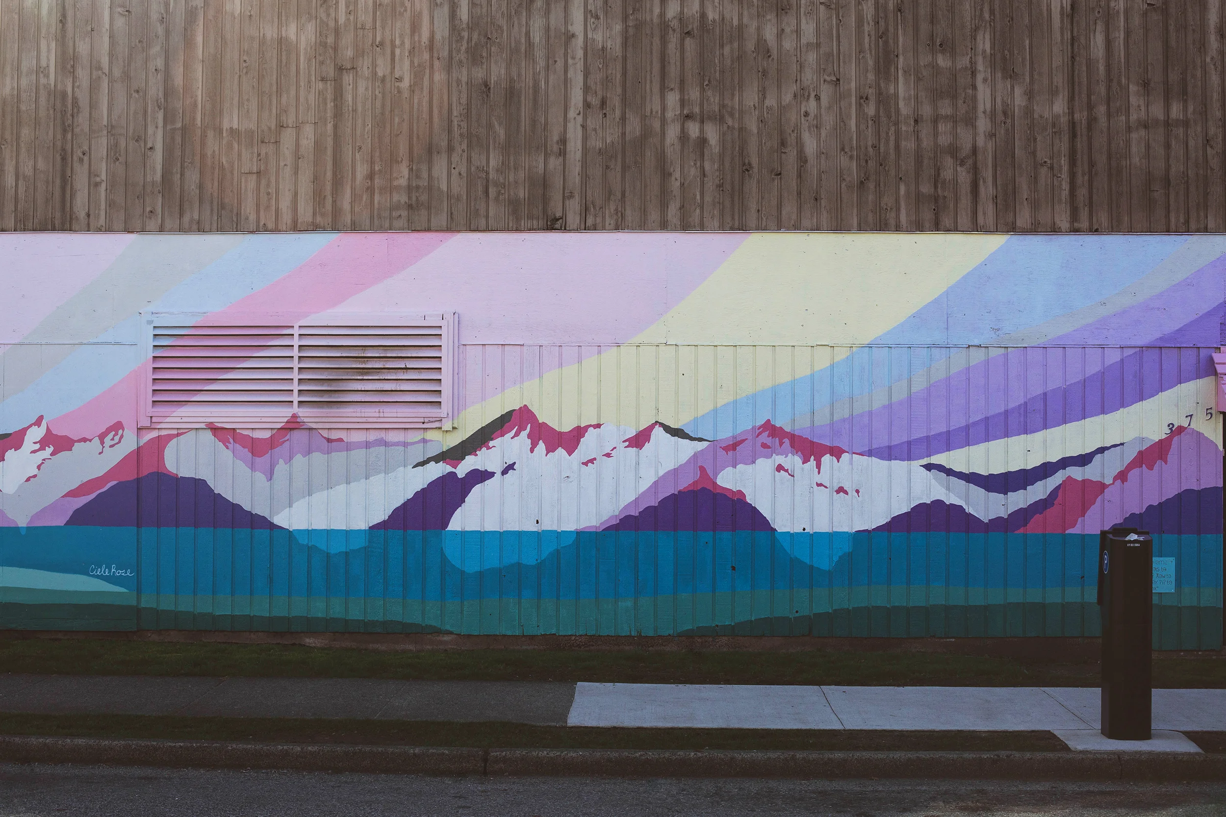 The mural wrapping the building is by local artist Ciele Rose.