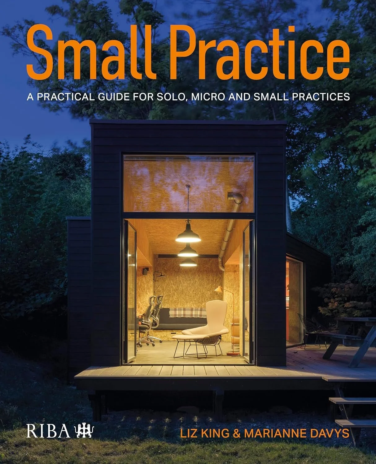 Book cover titled 'Small Practice: A practical guide for solo, micro and small practices' showing a small, modern office space with interior lighting, a lounge chair, and a desk with two office chairs, set inside a tiny black-built structure surrounded by trees.