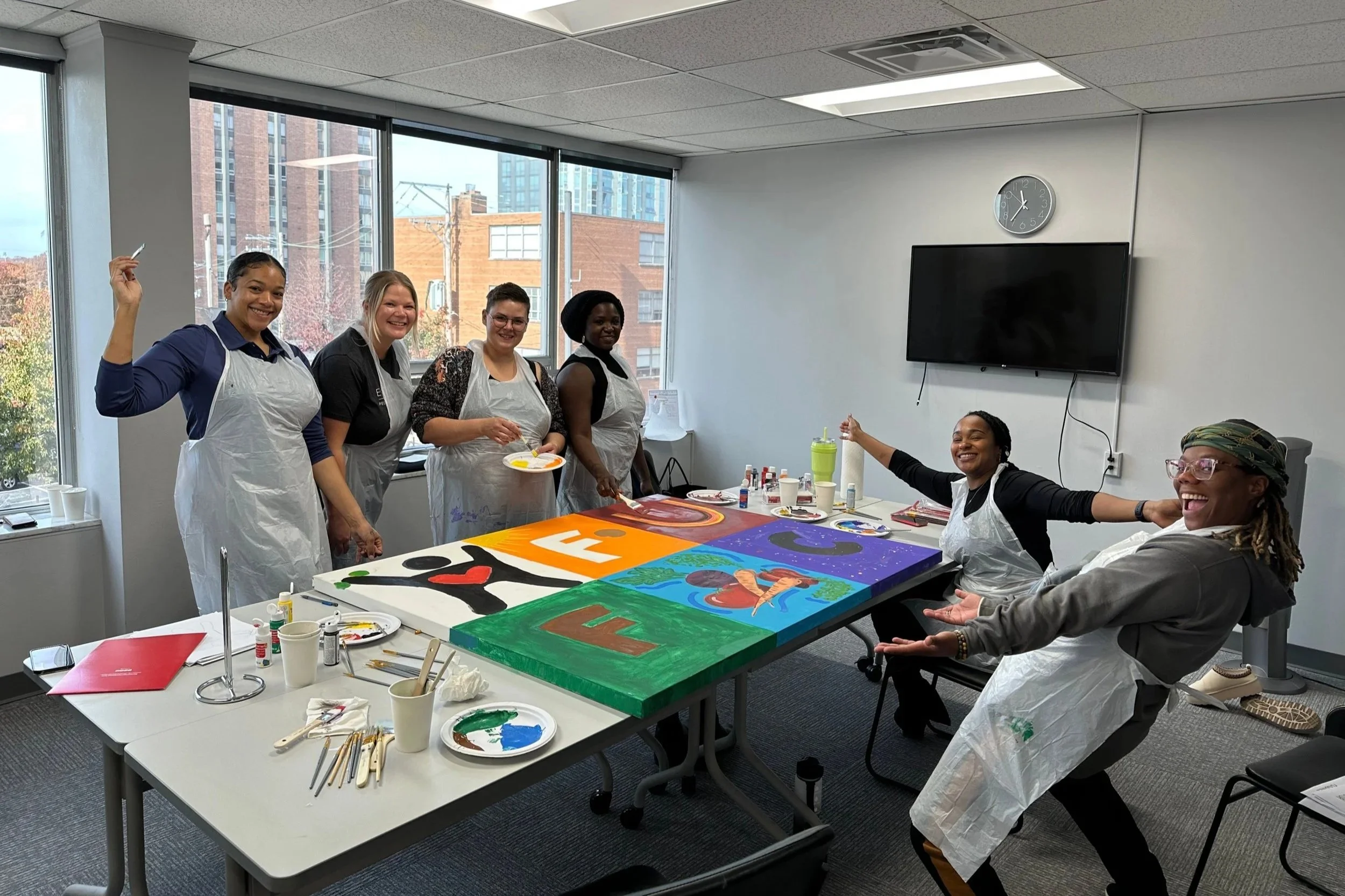 A group of people doing a team building activity at a coworking space