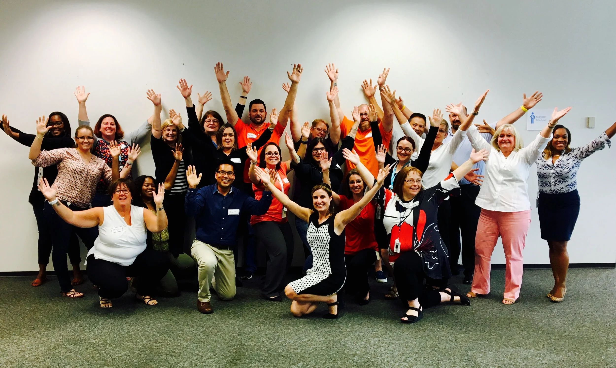 Kris – center front – leading a leadership workshop for first time managers.