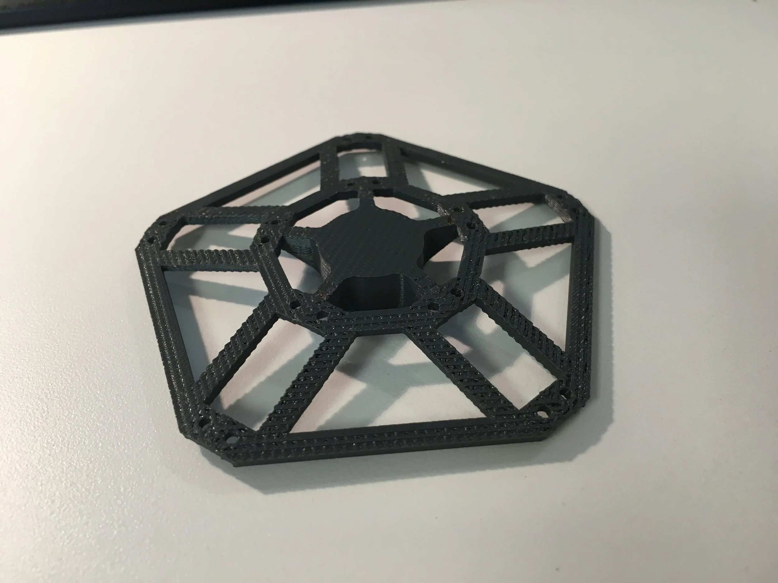 I 3d printed these brackets for the back side of each panel. It will connect to the fiberglass rods to get support from the core structure.