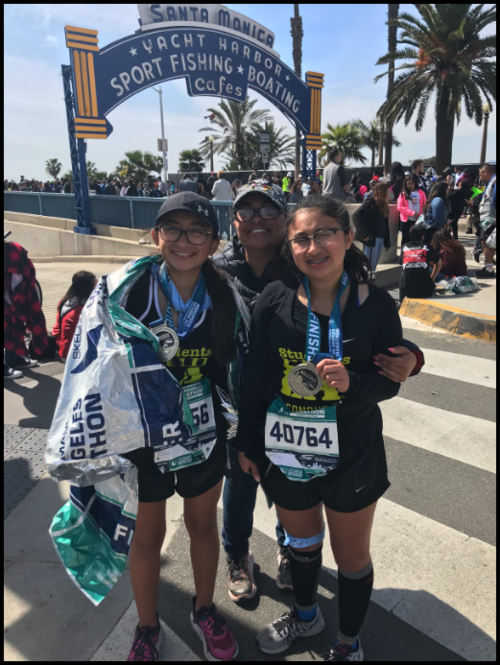 My first marathon with my sister and I.