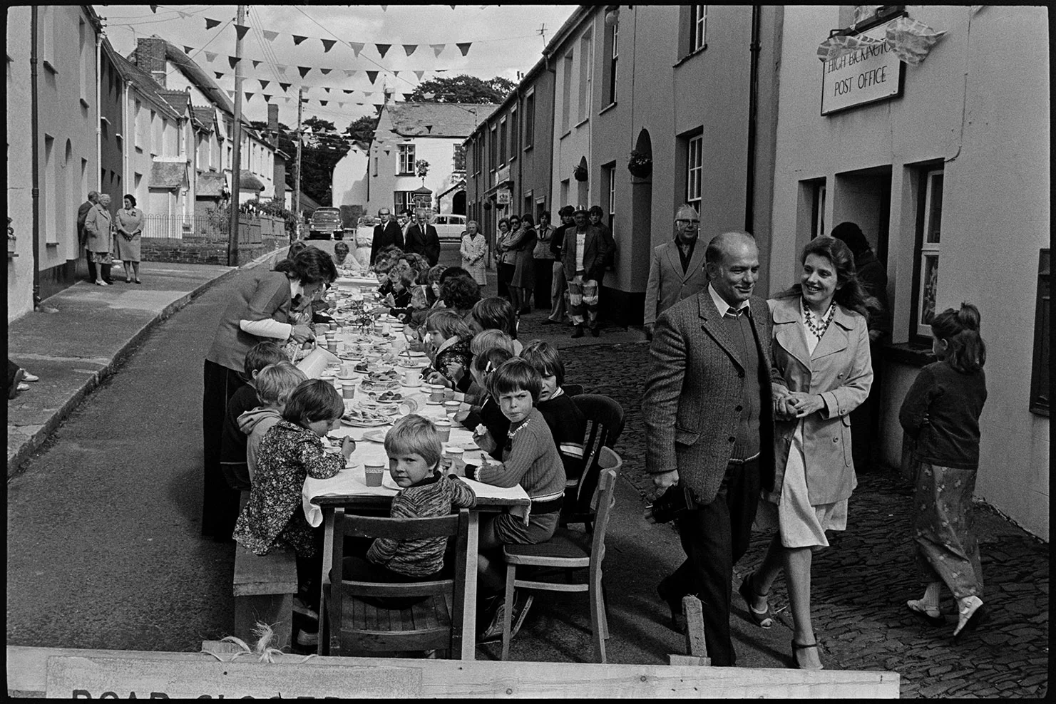 Children’s tea in village street, Jubilee time, High Bickington, June 1977. Documentary photograph by James Ravilious for the Beaford Archive © Beaford Arts