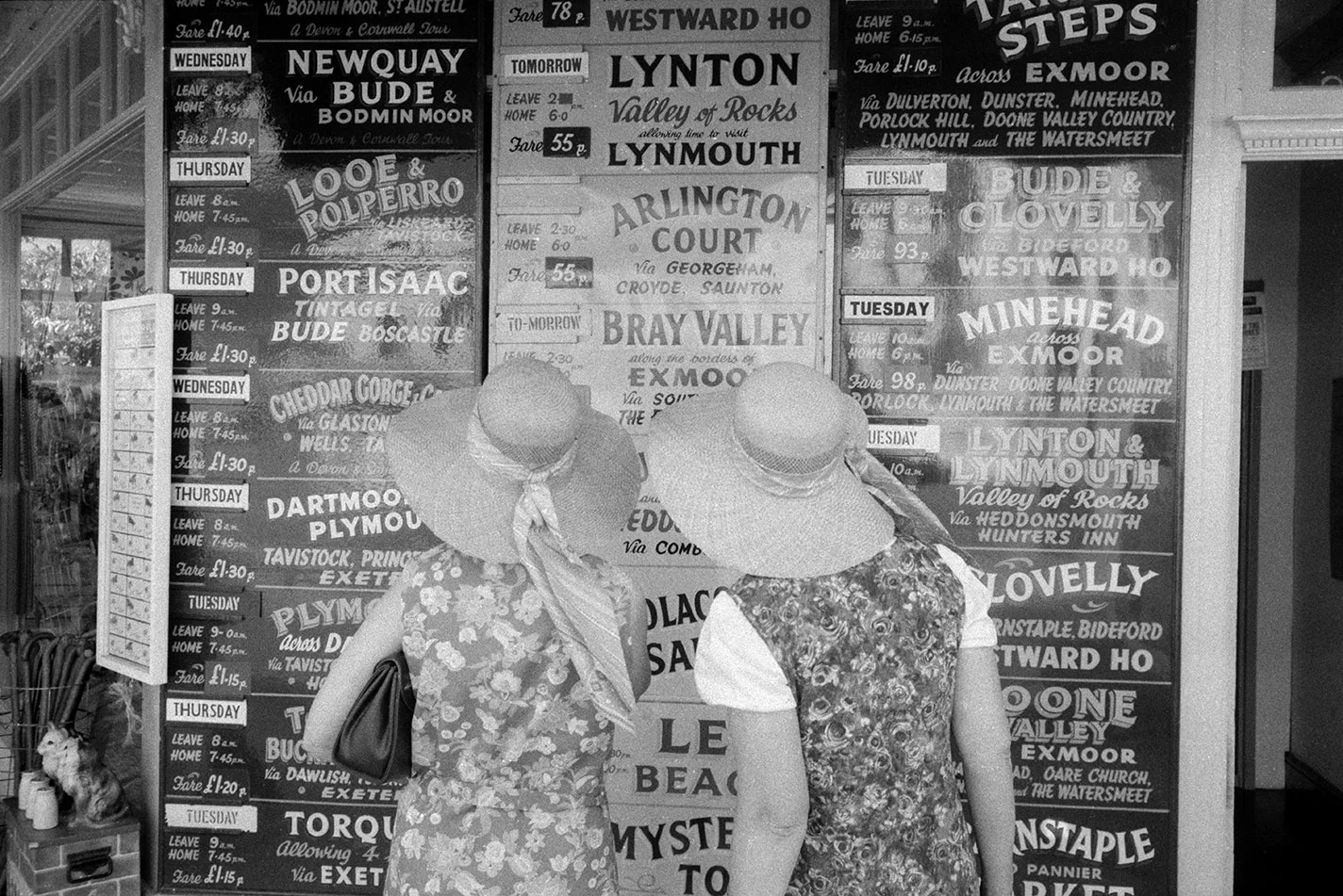 Women in hats with posters.