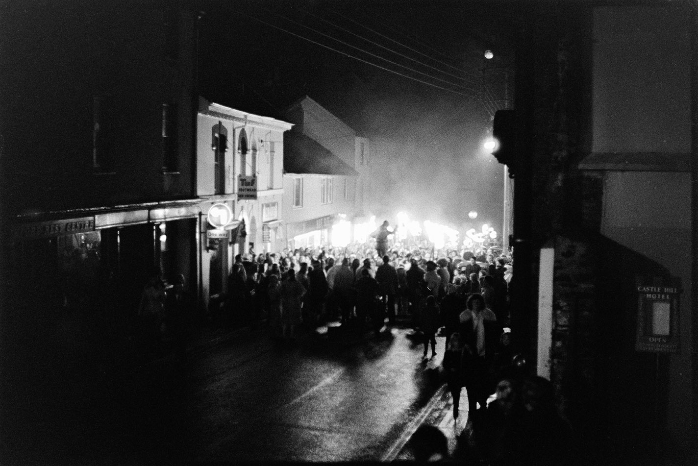 Wide angle street scene with torch bearers, Torrington, 2 November 1974