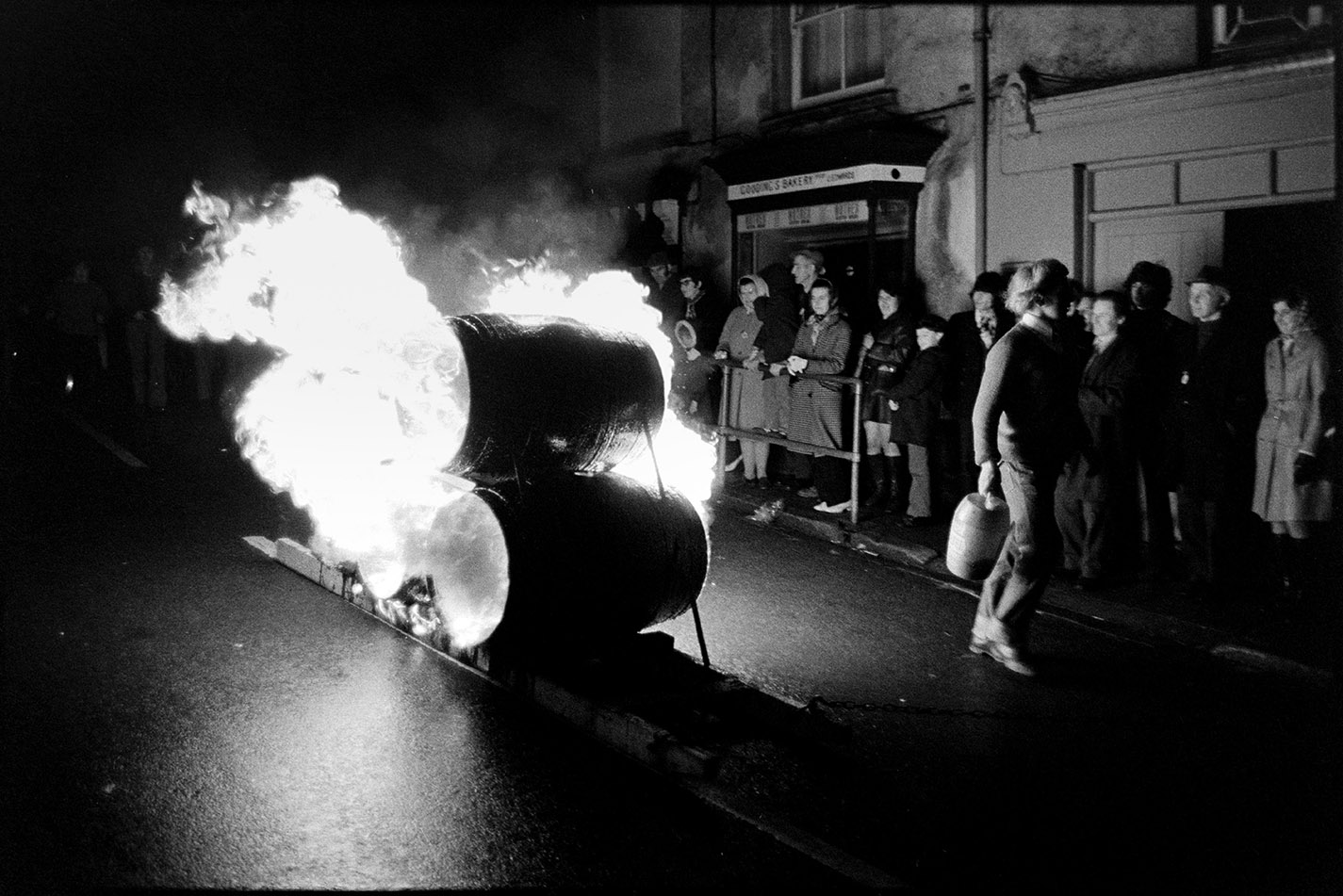 Burning tar barrels being pulled through the street at night, Hatherleigh, 6 November 1974