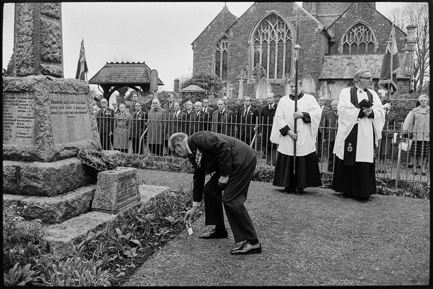 Armistice Day, man laying poppies.  Chulmleigh, November 1981