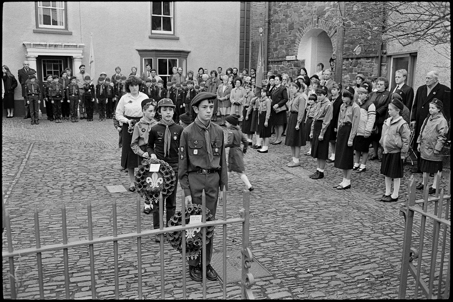 Parade at Memorial, laying wreaths by boy scouts.  Chulmleigh, November 1987