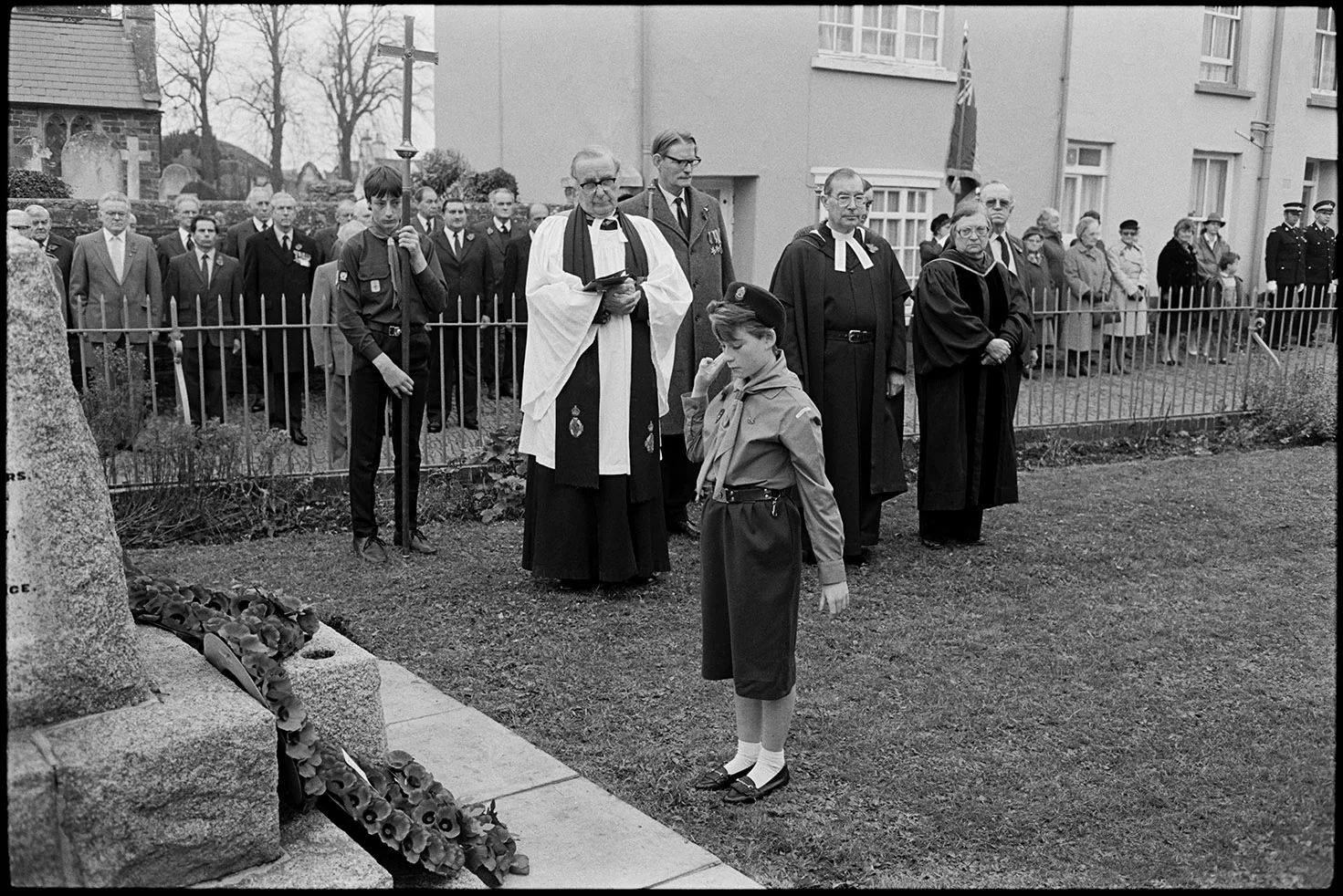 Parade at Memorial, laying wreath by girl guide. Chulmleigh, November 1987.