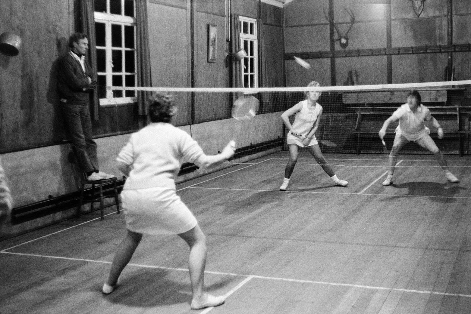 People playing badminton, 9 December 1971. Documentary photograph by Roger Deakins for the Beaford Archive.