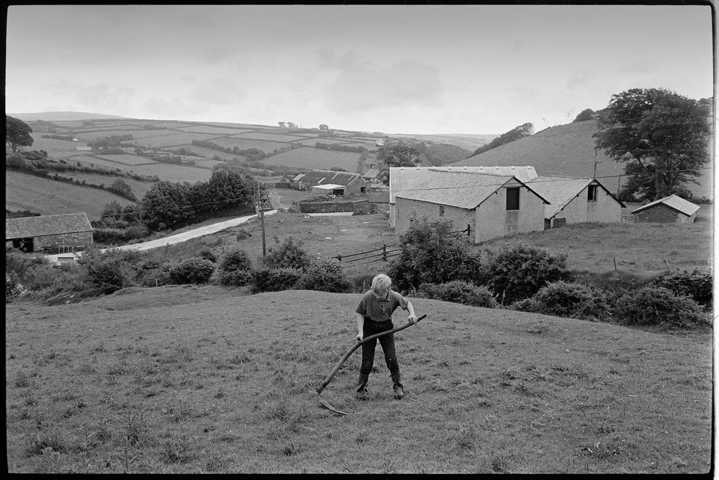 Boy scything, Bratton Fleming, July 1974. Documentary photograph by James Ravilious for the Beaford Archive © Beaford Arts