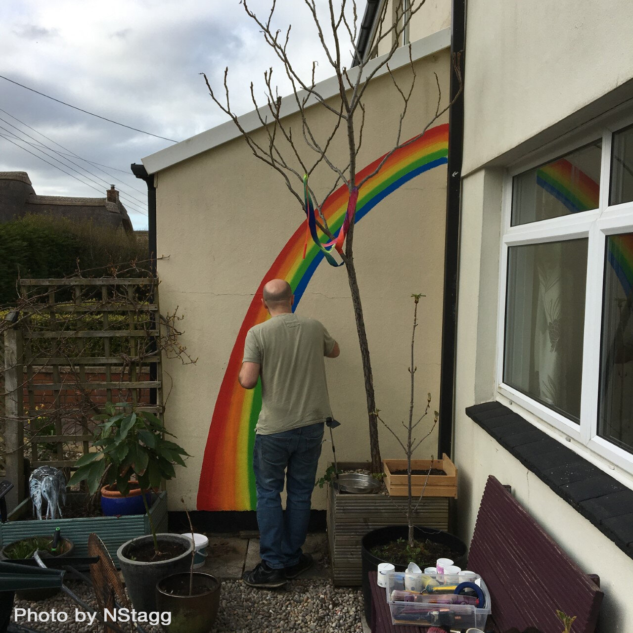 Atherington Local mural artist painting rainbow supporting NHS 030420 NStagg.jpg