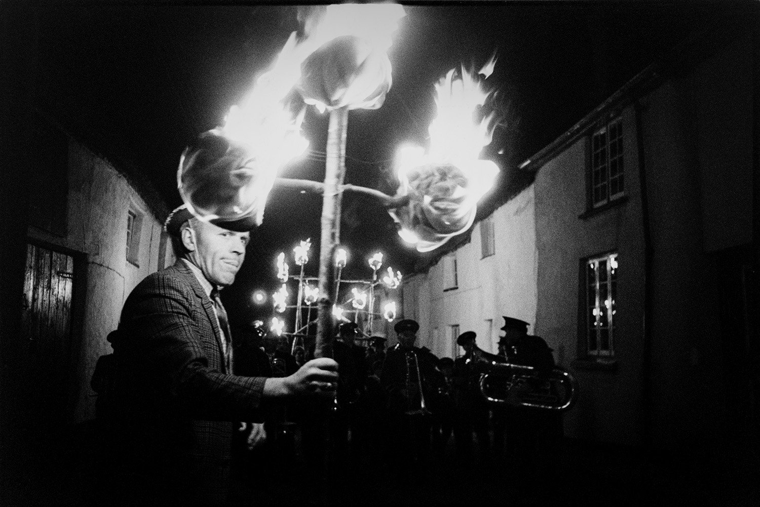 DEA-03-0007-23 Man carrying flaming torch in procession, Hatherleigh, 1971.jpg
