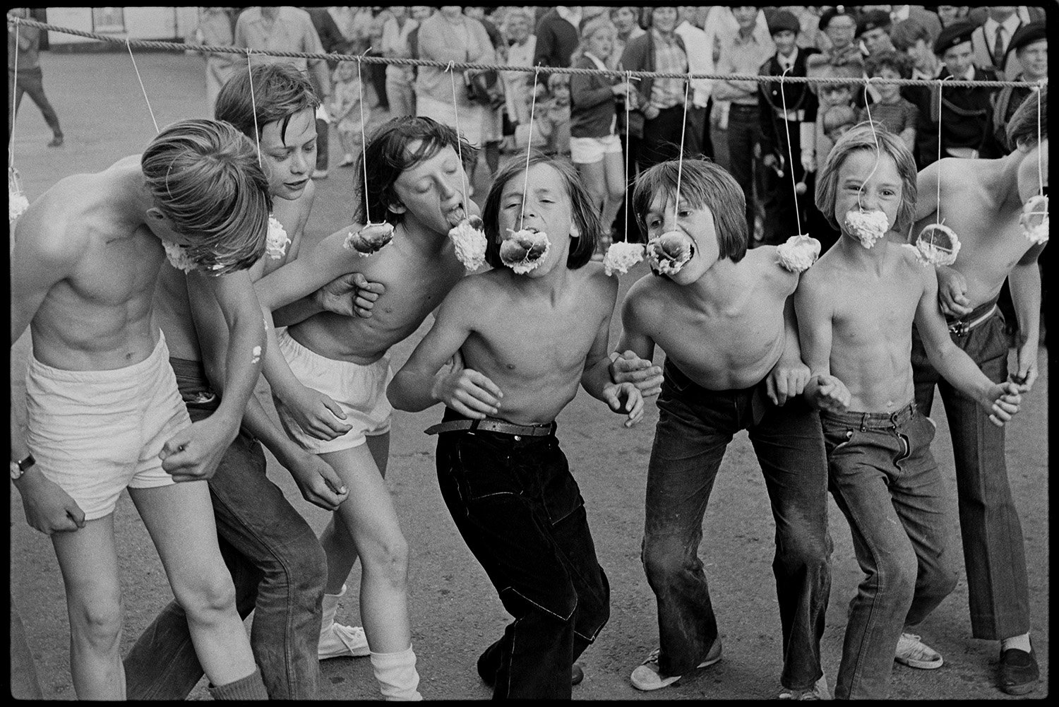 DEA-03-0061-35 Boys competeing to eat iced buns, Chulmleigh Fair, 1972.jpg