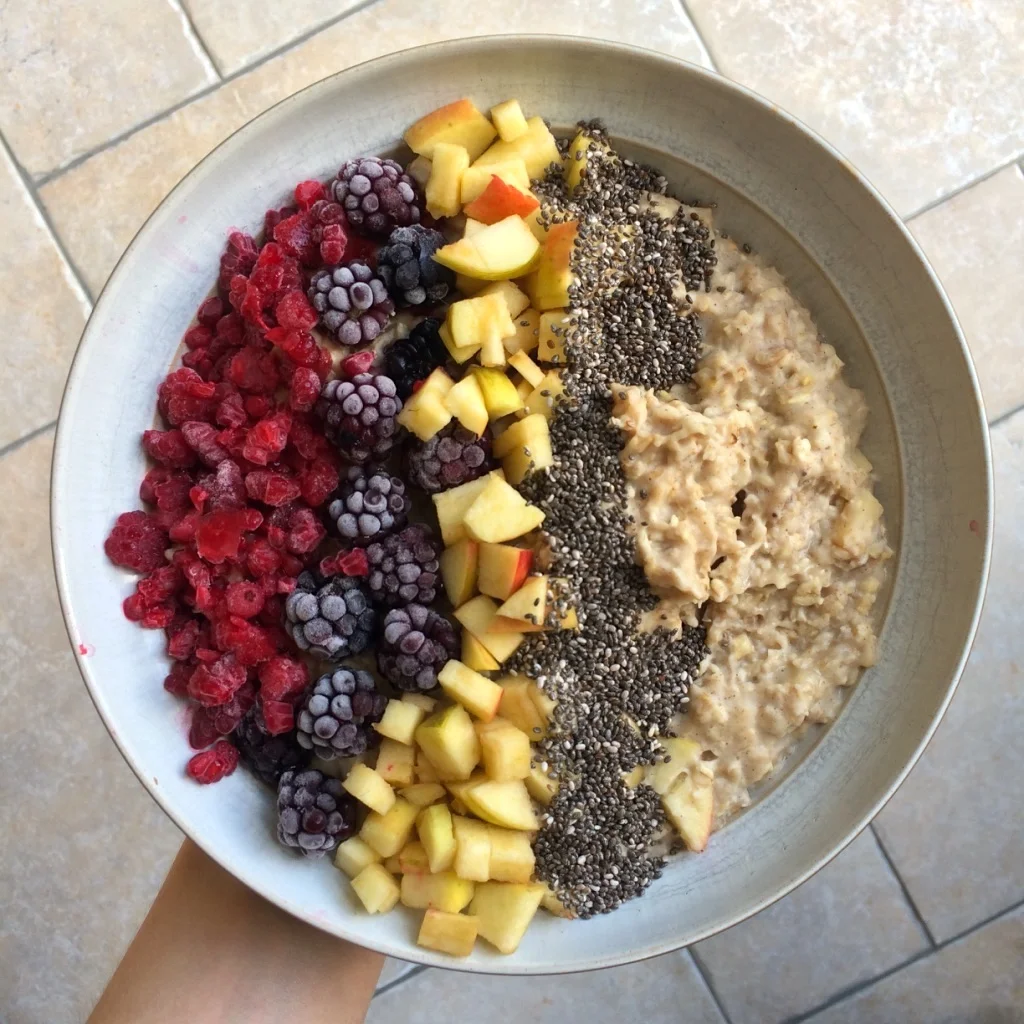 Home-grown apple oatmeal with frozen berries, more diced apple and a very generous sprinkling of chia seeds. 