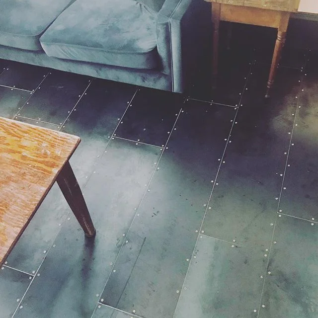 We cannot get over how fantastic these Corten Hot Roll Steel, asymmetric, tripanel 1/3 stagger floors with real brass screws @postcommons came out!!! One thing left to do.......our proprietary hand rubbed finish. Crazy cool and beautiful. #corten #he