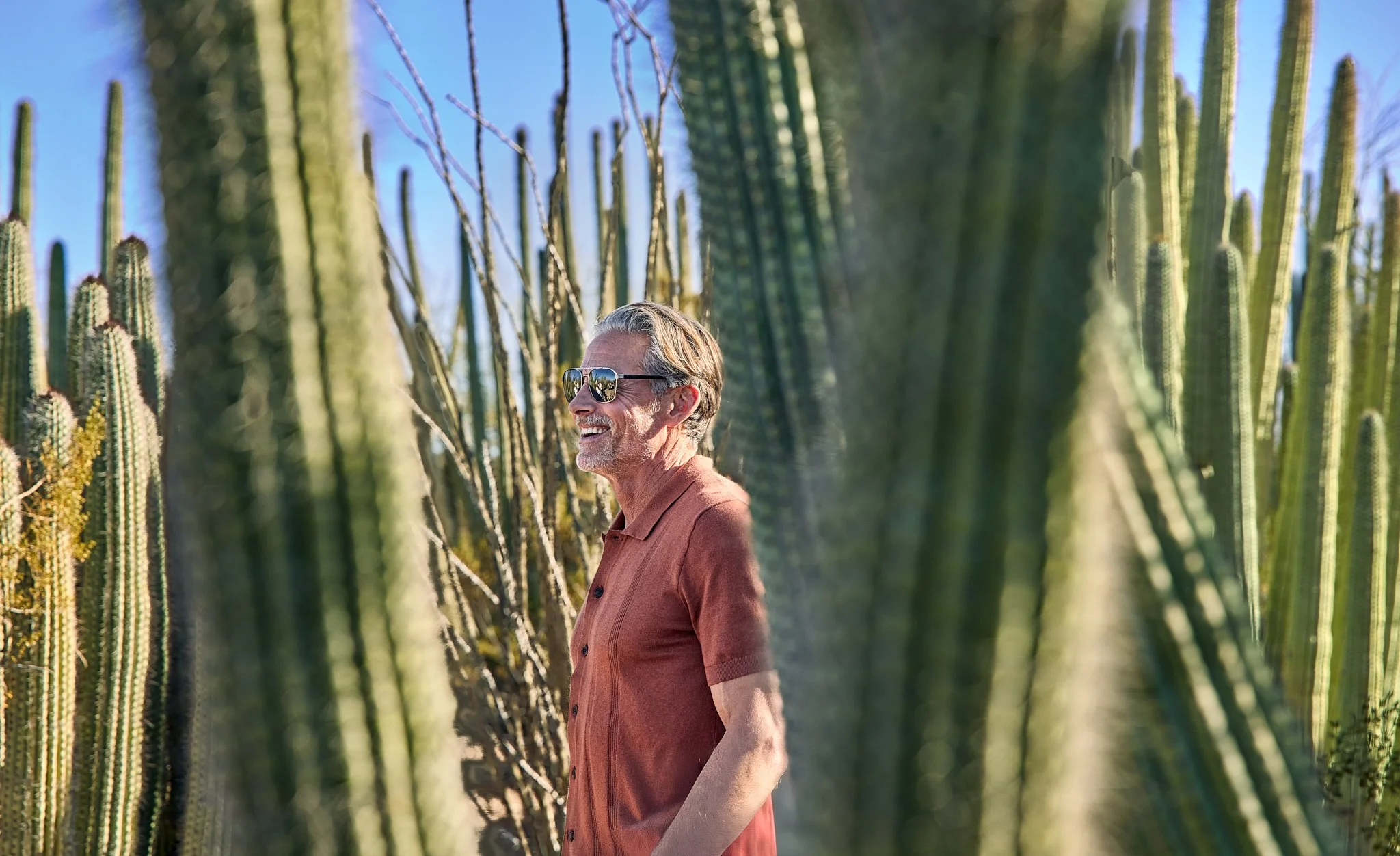 Environmental lifestyle portrait photographed by George Kamper in a natural outdoor setting for Travel + Leisure