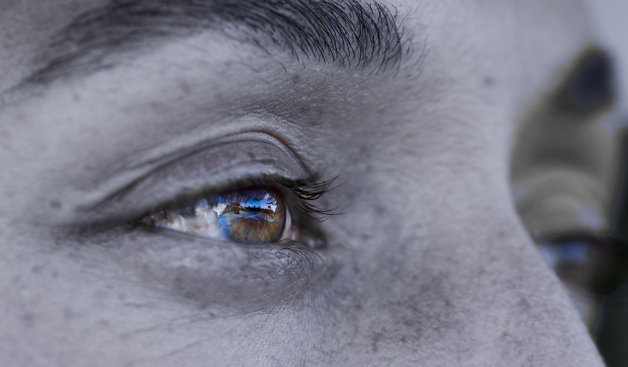 Extreme close-up of Jessica Pegula’s eye reflecting a tennis court during Vital Proteins campaign