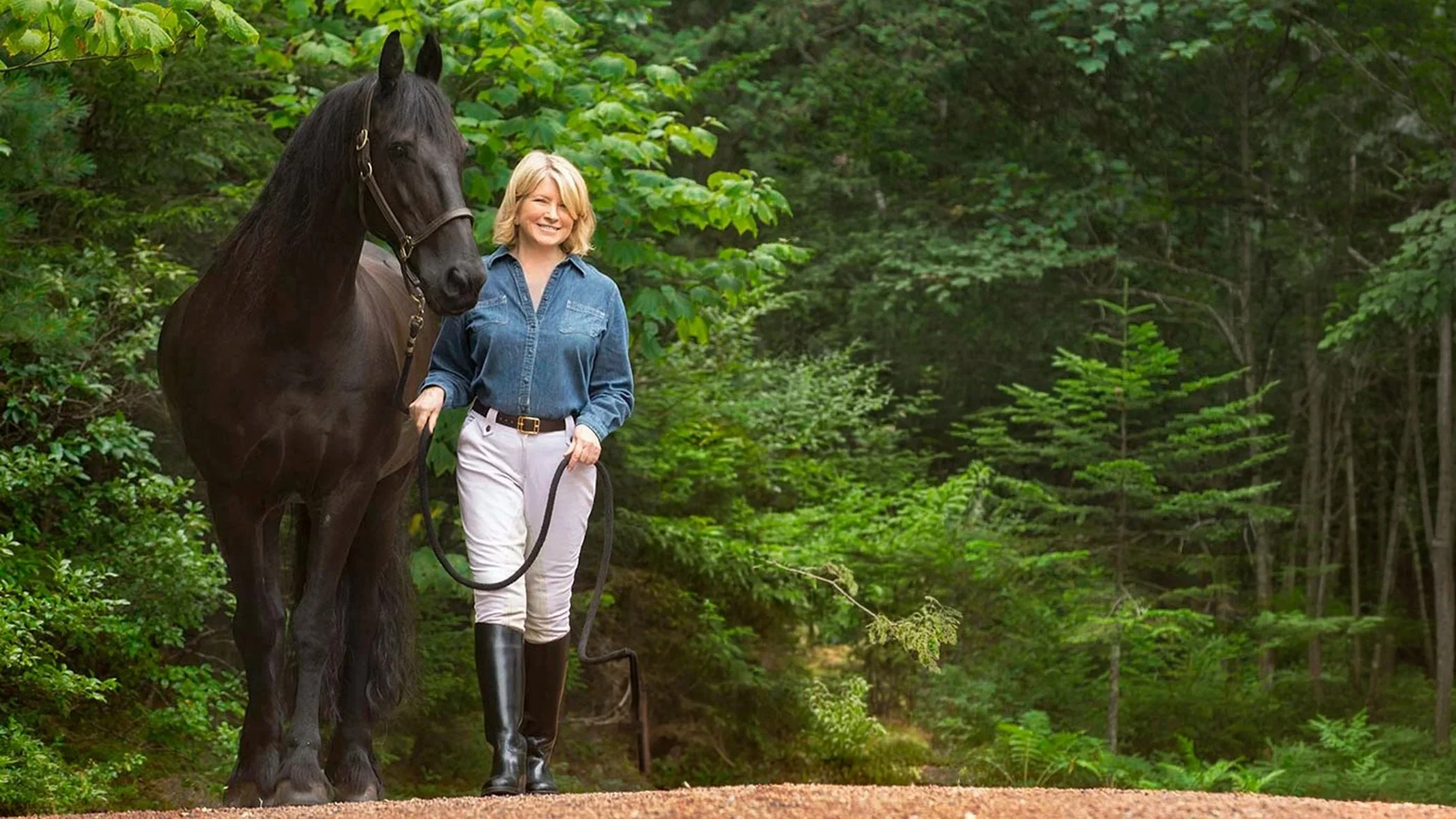 Martha Stewart portrait with horse in forest setting by commercial photographer George Kamper