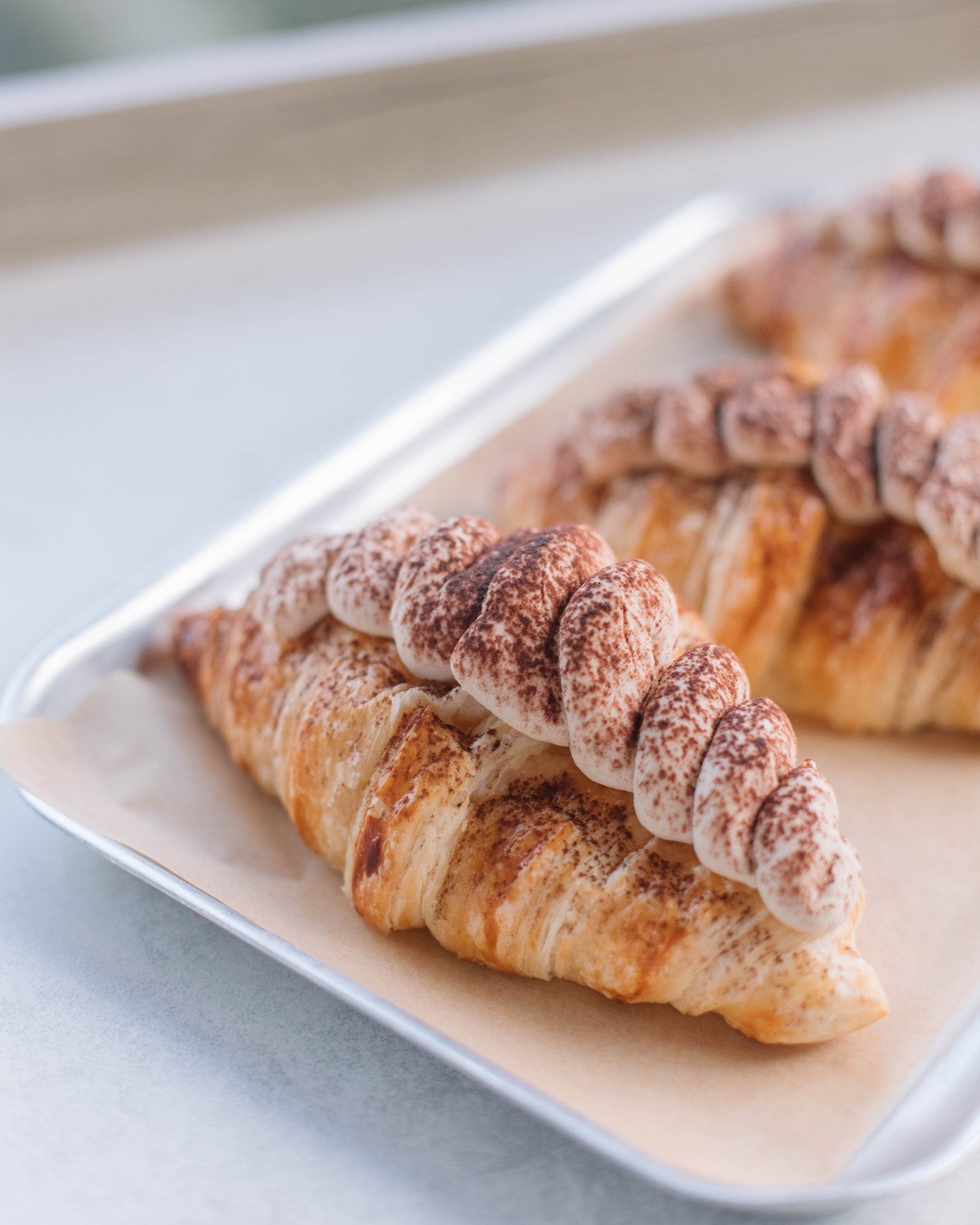 Tiramisu, but make it flaky 🥐

Fresh on the counter today, while they last. 

#TiramisuCroissant #CoffeeAndPastry #BakedGoodness #CroissantUpgraded #TheWorkhouse