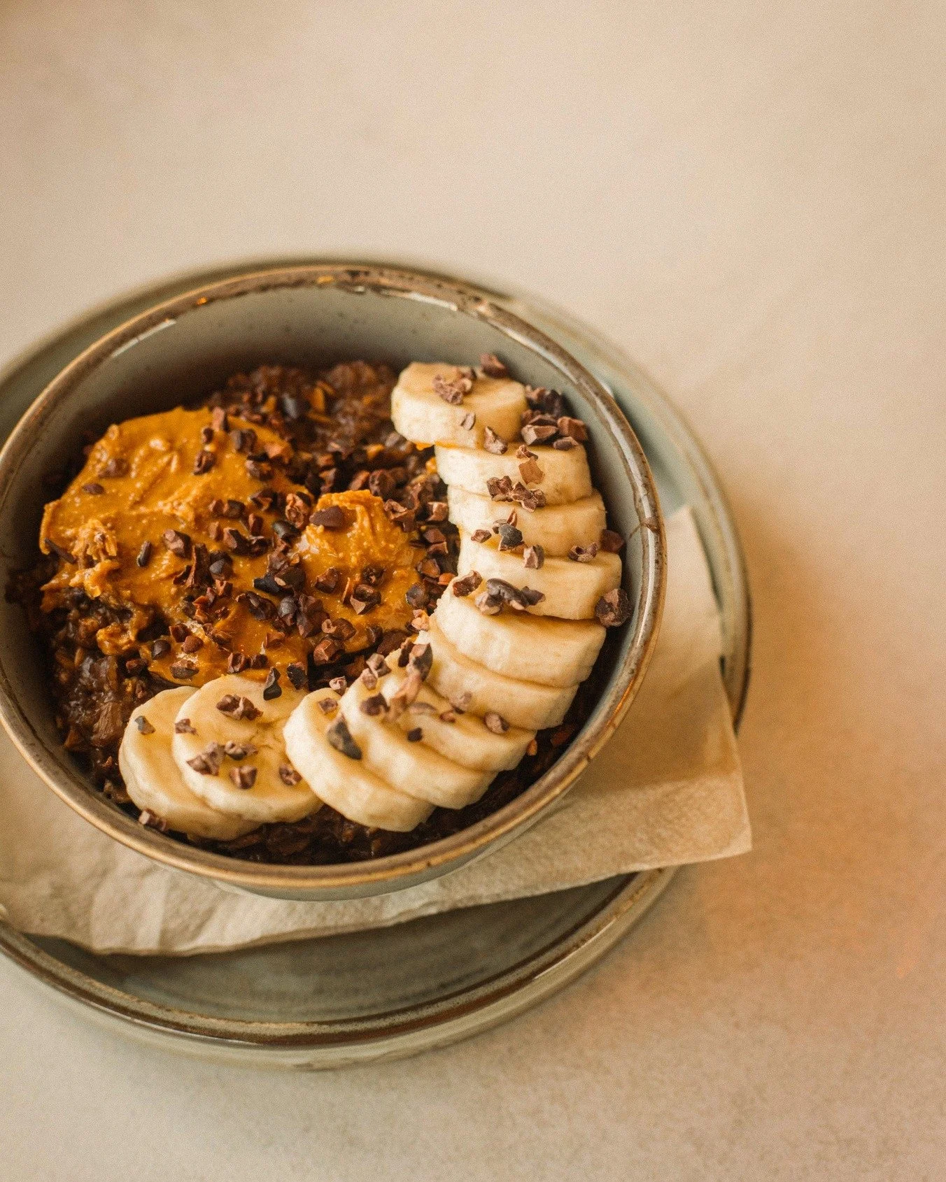 A bowl full of good mood energy 🍫✨

Creamy chocolate porridge made with chocolate oat milk, topped with banana, crunchy peanut butter &amp; cacao nibs.

Available to eat in or takeaway &amp; perfectly paired with your favourite Workhouse coffee ☕✨

