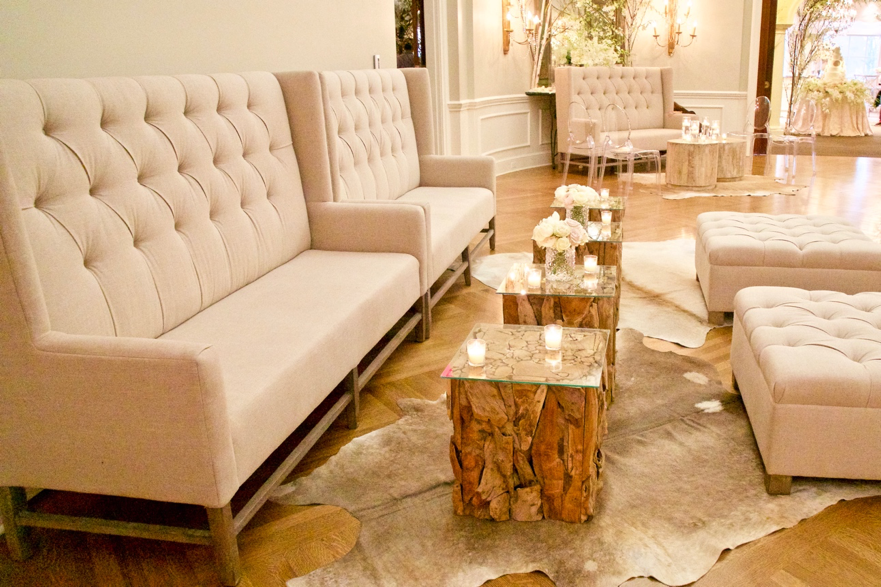 We filled the large space of the ballroom with one of our favorite furnishing settings, the Sasha natural banquettes with Juliet ottomans, acting as the main source of seating. To balance the softness, as we often like to do, the lounge area also included Singapore teak wood side tables, and cowhide rugs. The room also featured another seating arrangement including the Sasha banquette as well but with a mix of Sierra side & coffee tables, ghost chairs, and a cowhide rug to continue mixing classic, rustic and modern elements.
