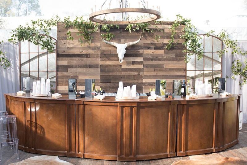 curved wood bar, windowpane mirrors, wood wall, bar back with mirrors and wood 