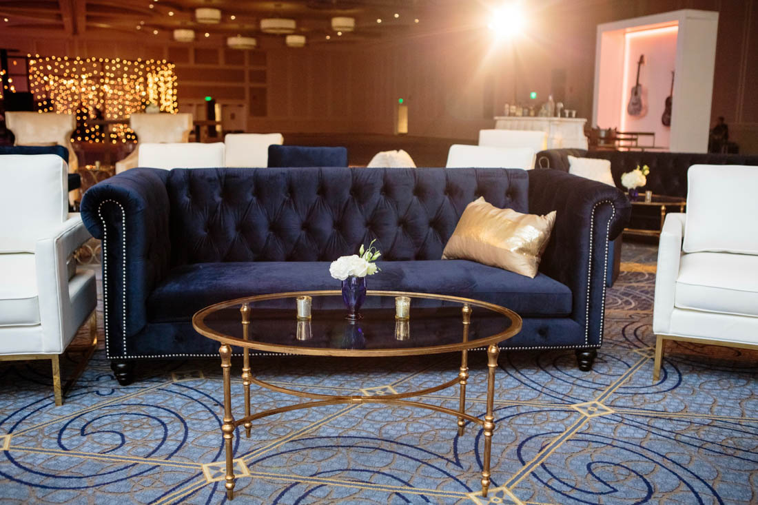 blue sofa, velvet sofa, gold coffee table, gold pillow