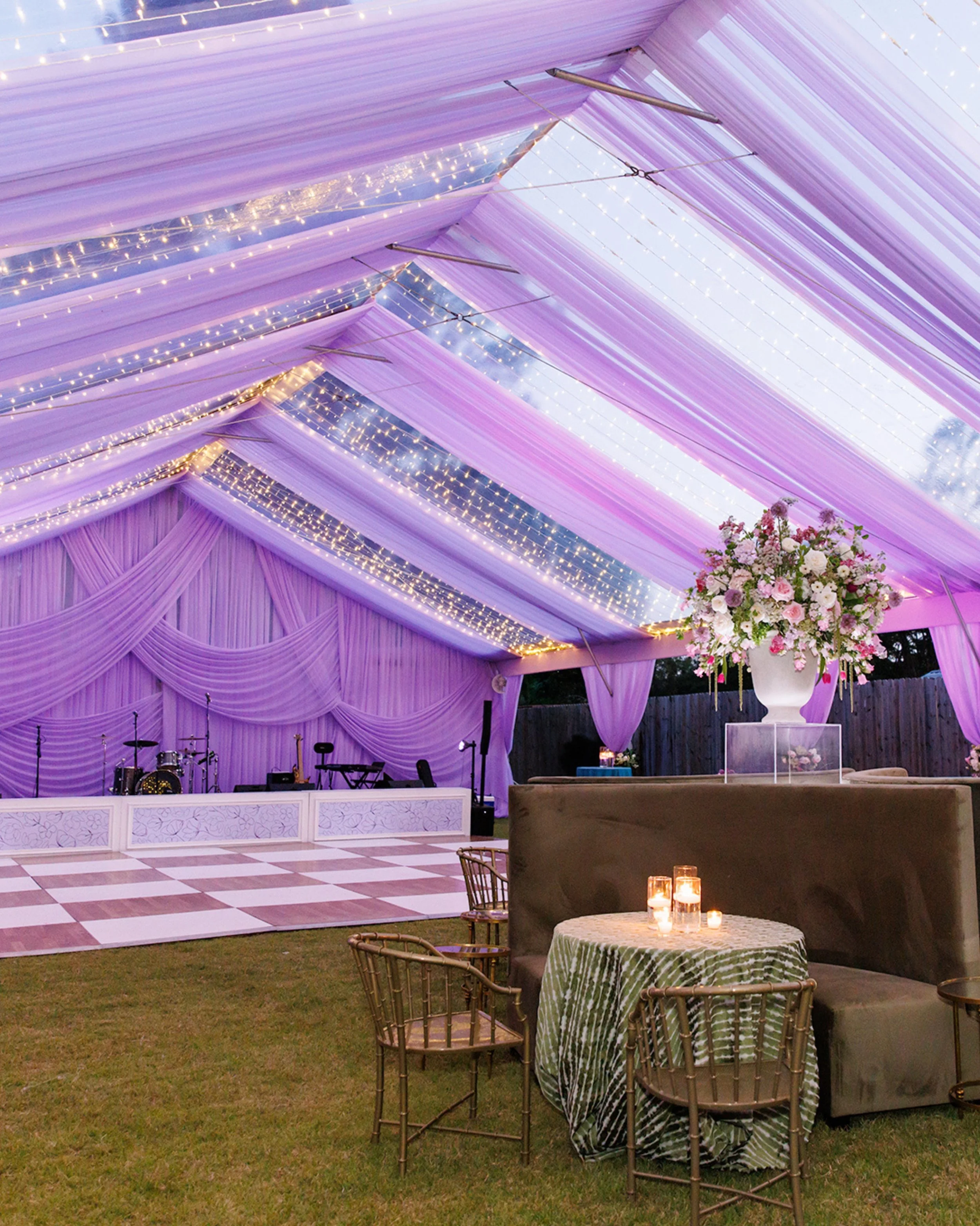 May 2026 | Memphis Botanic Garden

A closer look at the custom details 💜
From floor-to-ceiling lilac voile draping inside the tent to sparkling curtain lights woven throughout the ceiling installation, every layer was designed to create an immersive