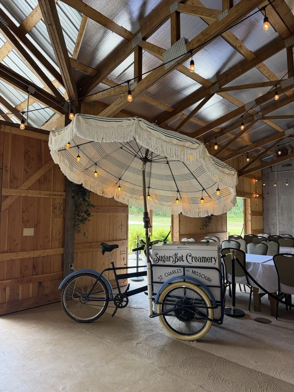 SugarBot Creamery's Ice Cream Bike at a rustic wedding venue