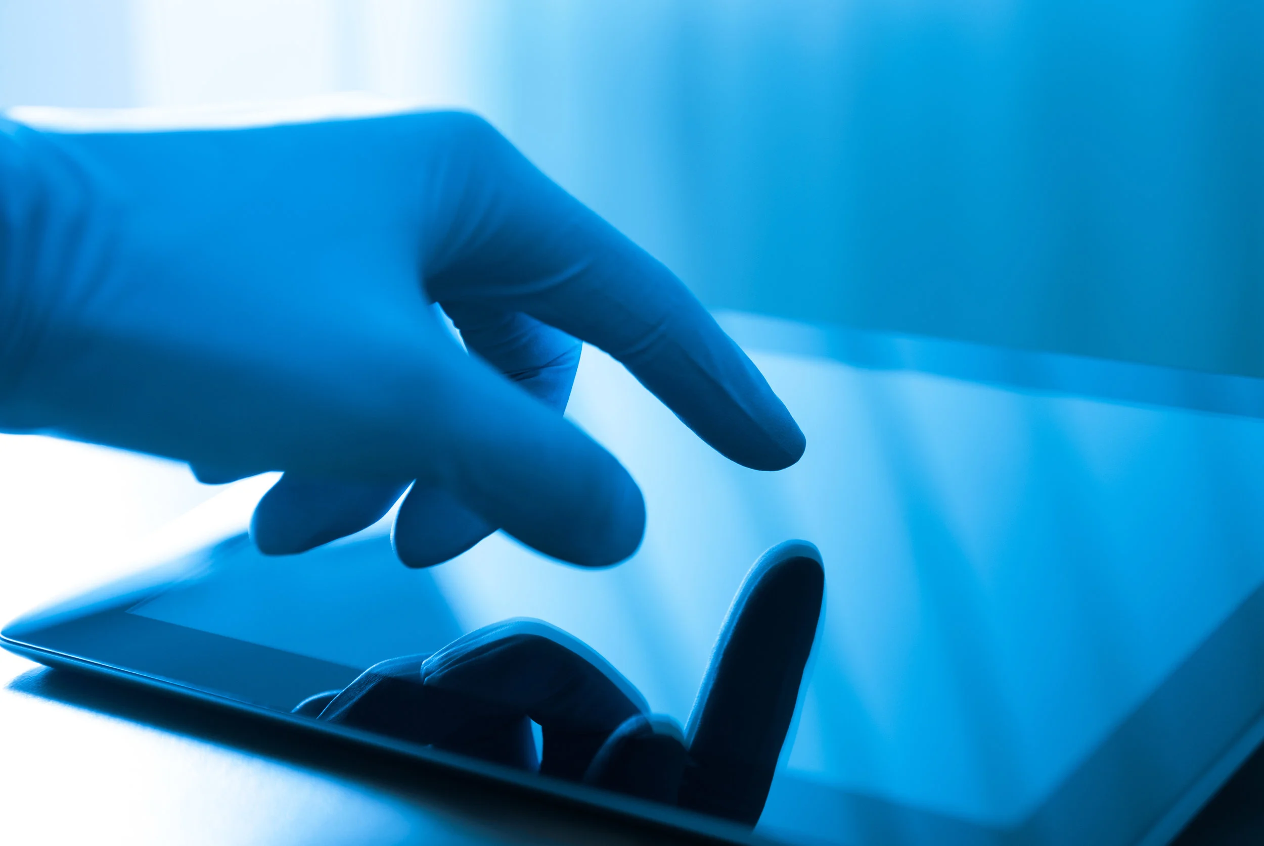 bigstock-Doctor-Touching-On-Apple-Ipad-32866610.jpg