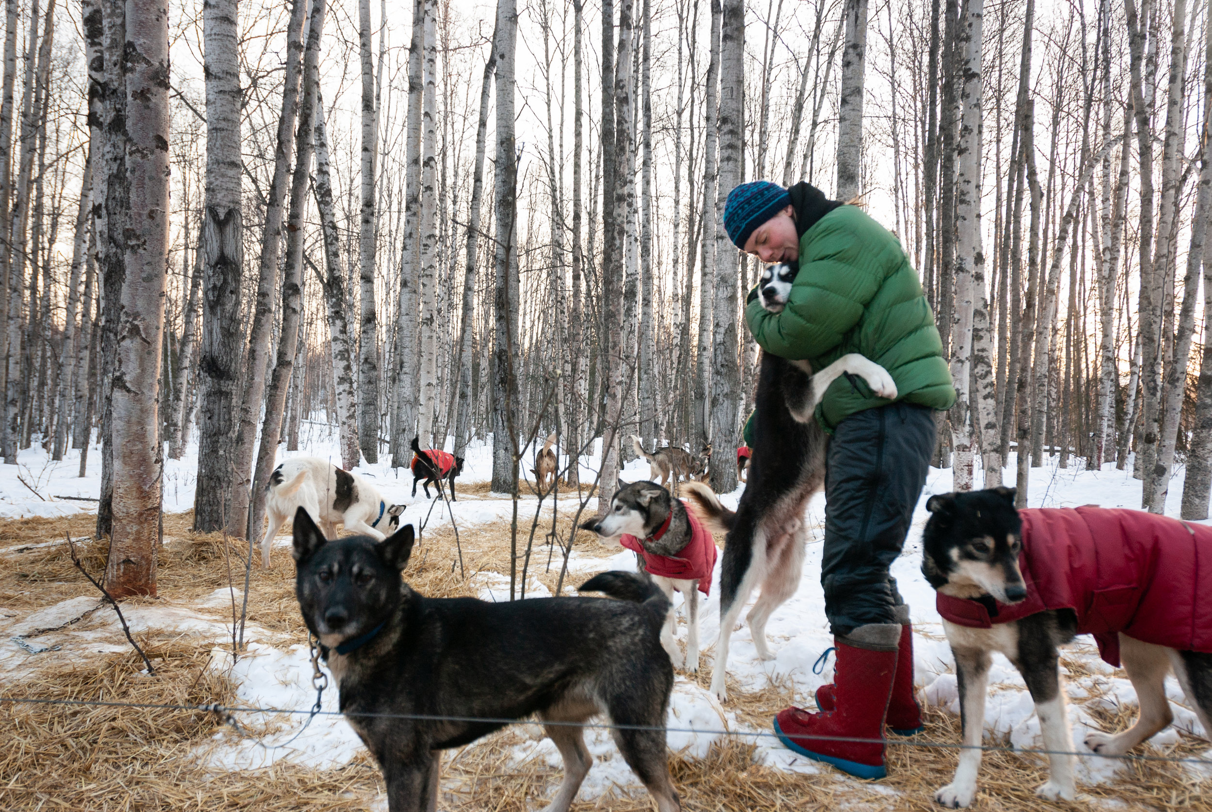 Sigrid gets a hug from Puck, her goofiest dog. Knik, Alaska. February 2007.