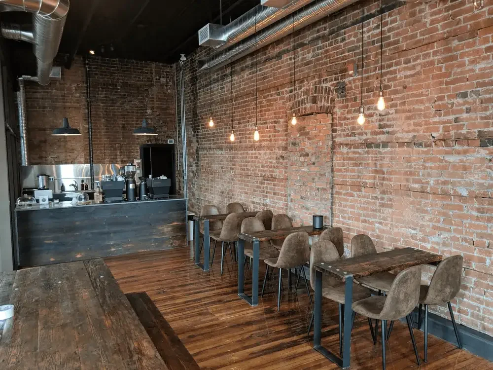 coffee bar with seating area, espresso machine receptacle, hot water boiler wiring, fridge wiring, pos wiring.