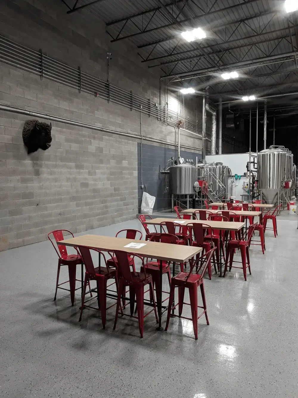 seating area in brewery overlooking brewery eqipment