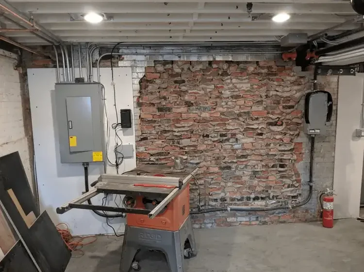 100 amp panel which was relocated to basement to allow for seating area upstairs with new disconnect to extend panel closer to outside wall. led pot lights and receptacles for manufacturing equipment installed in basement as well.