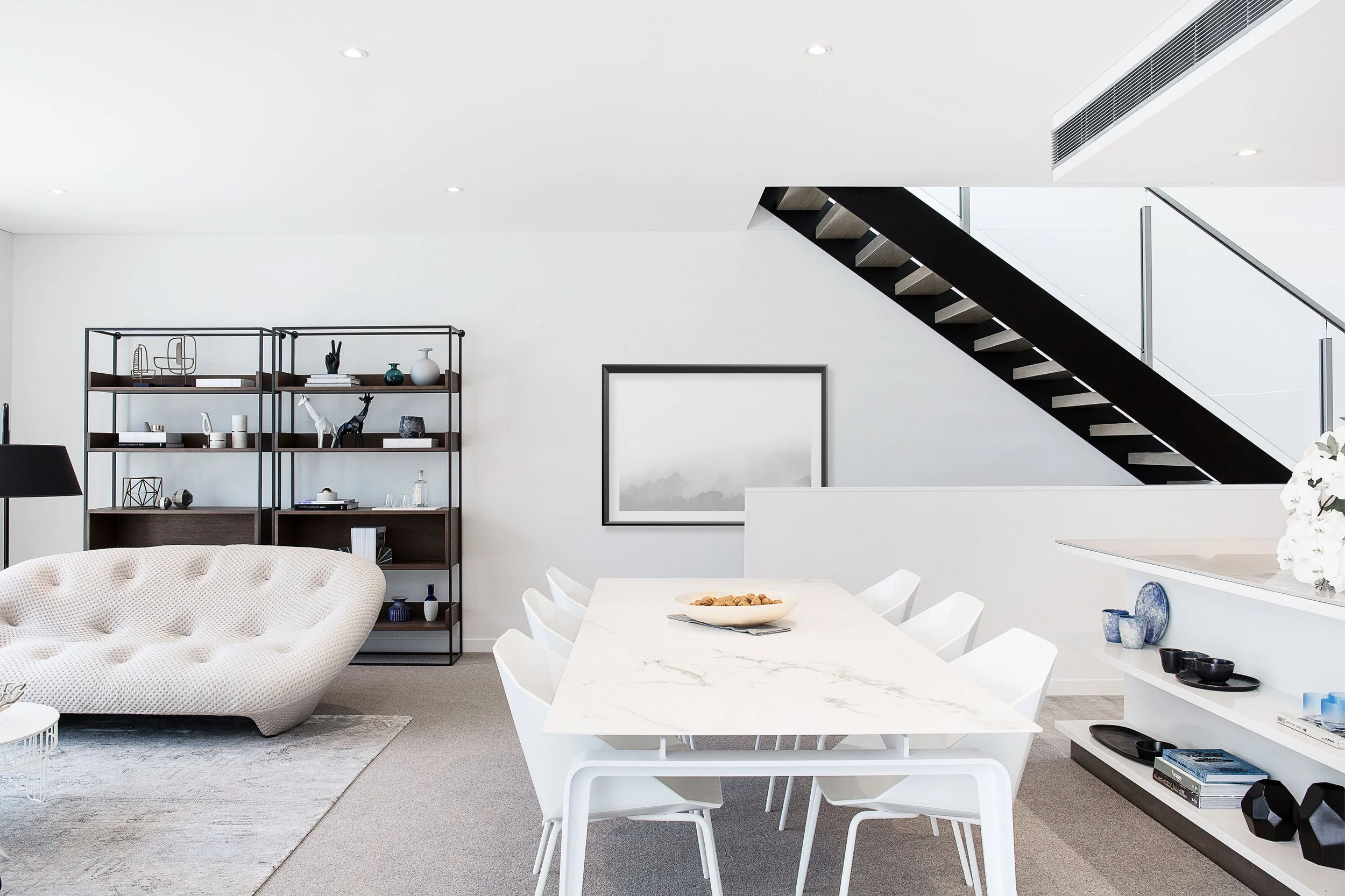 Wide living room view highlighting open plan layout and interior styling in a Mirvac Docklands townhouse