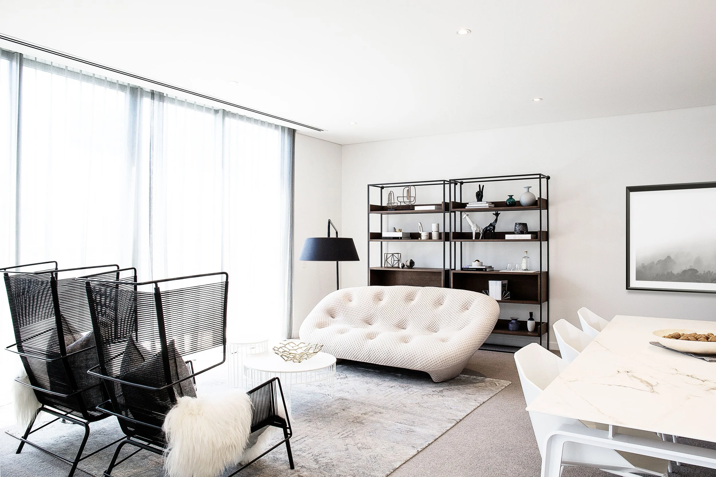 Living room styling detail with sculptural furniture and neutral materials in a Docklands townhouse
